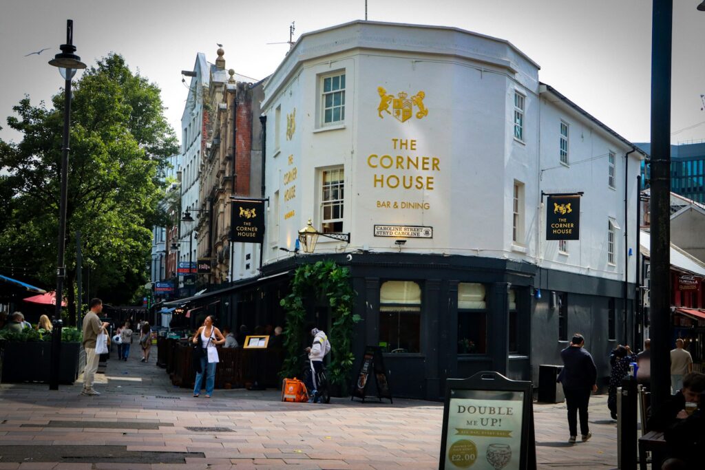 The corner house pub on a city street.